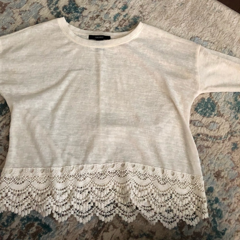 Adorable cream sweater with lace bottom details
